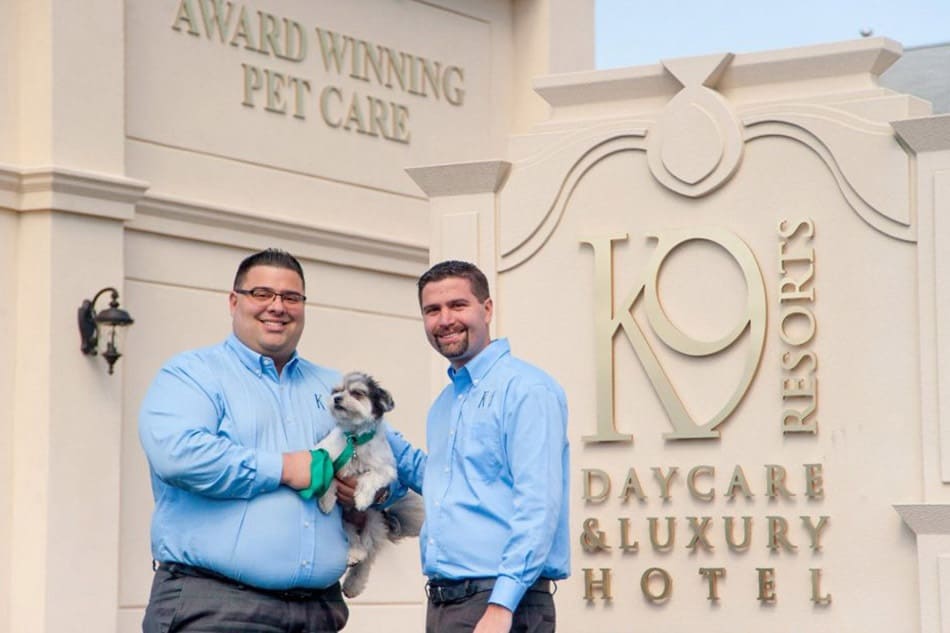 Photo of Steven and Jason Parker in front of K9 Resorts Luxury Pet Hotel